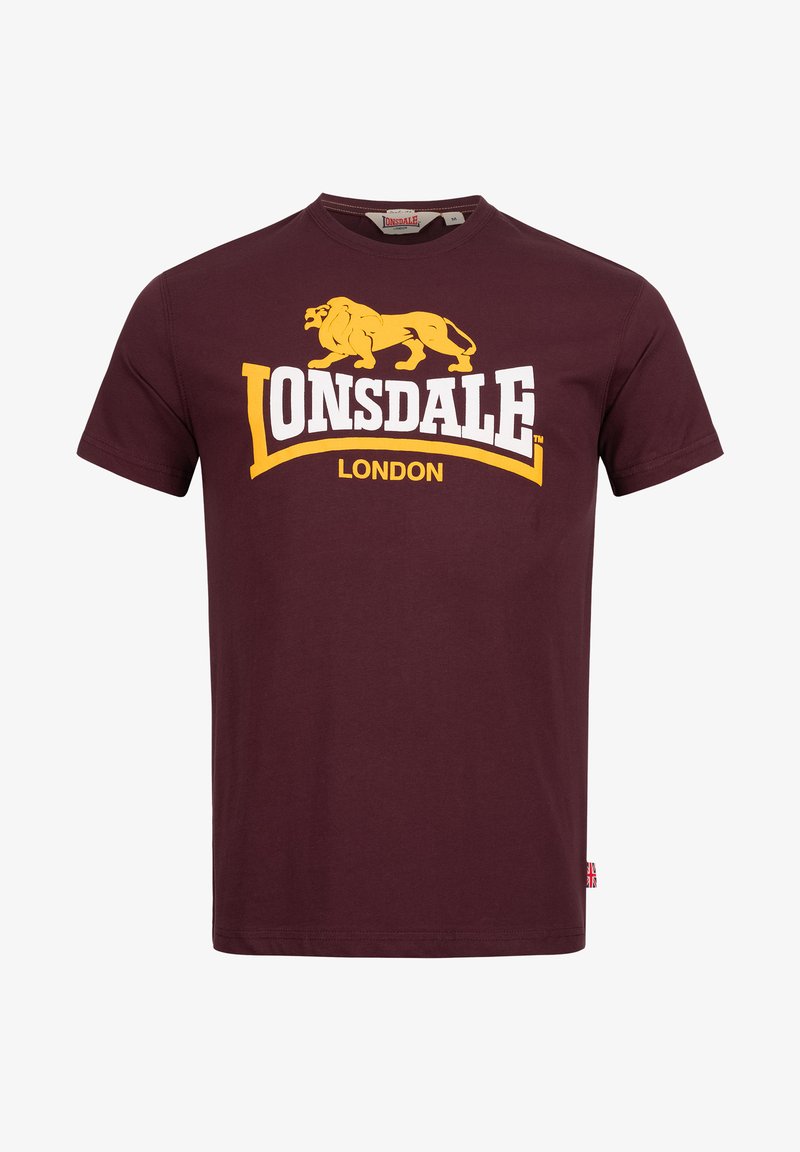 Bordoo puuvillane T-särk graafilise printimisega. Omab kollast lõvi logo ja valget teksti "LONSDALE LONDON". Ümmargune kaelus, lühikesed varrukad.