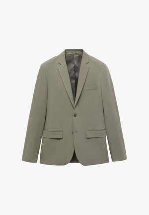 Olivgrön kavaj med spetsig krage, två framfickor och stängning med en enda knapp. Har ett mjukt innerfoder för komfort.