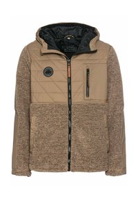 Tan jakke med quiltet design på overdelen og fuzzy tekstur forneden. Har en lynlåslomme, hætte og broderet logo på brystet.