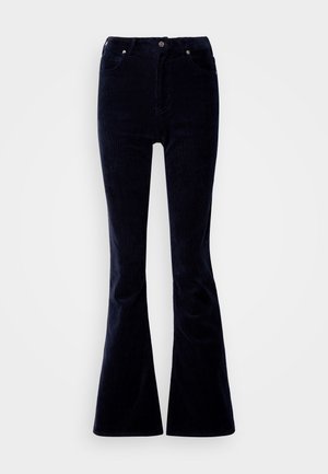 Pantalons en velours côtelé bleu marine à jambes évasées avec taille haute, comportant cinq poches et une fermeture à bouton en métal, tissu texturé et jambes larges.