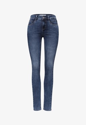 Tummansiniset slim fit -farkut, joissa napin ja vetoketjun suljenta, etu- ja takataskut, haalistuneet yksityiskohdat ja ommellut saumat.