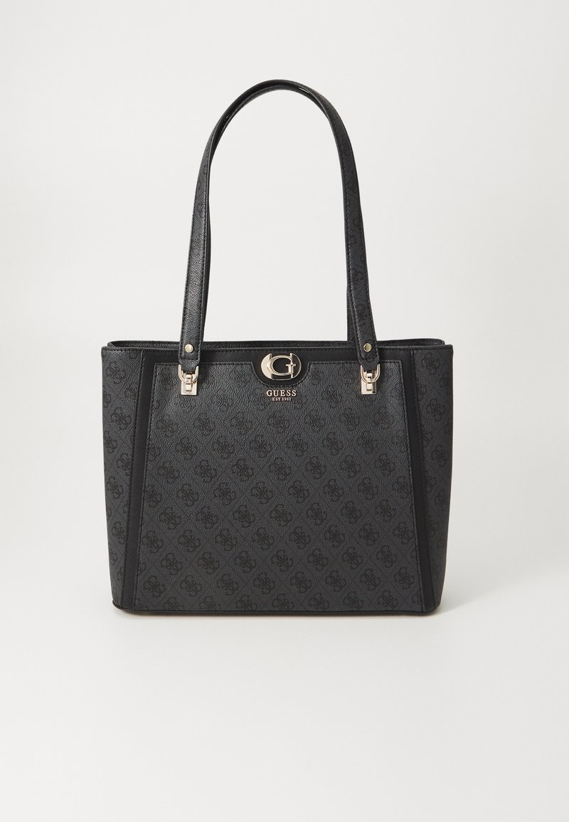 Black tote bag with textured finish, featuring dual handles, gold-tone hardware, and embossed logo pattern on fabric. Square shape.