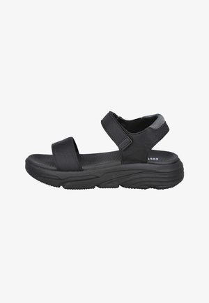 Sandalia deportiva negra con dos tiras ajustables, suela acolchada y plantilla texturizada, diseñada para la comodidad y el uso informal.