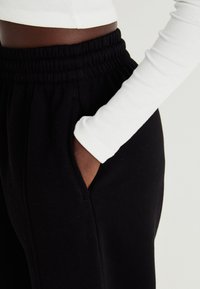 GAP BAGGY - Tepláky - true black