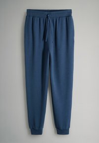 Kék texturált kötött jogging nadrág elasztikus derékrésszel, húzózsinórral, oldalzsebekkel és bordázott boka mandzsettákkal.