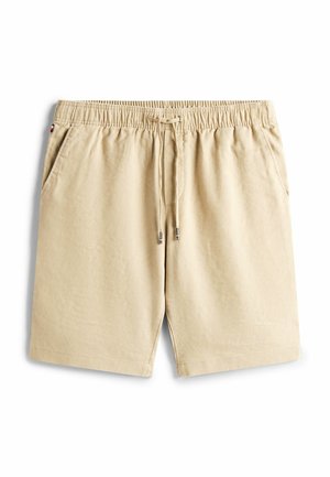 Beige bomuldsshorts med elastisk talje og snørering. Har to sidelommer og en afslappet pasform. Glat tekstur, uden mønstre.