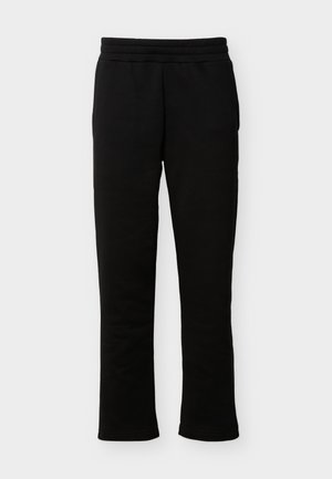 Pantaloni de trening negri, cu picior drept, talie elastică și buzunare laterale, așezați drept pe un fundal alb.