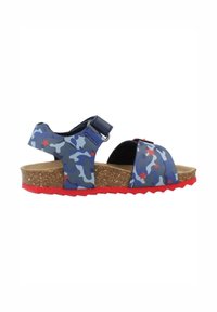 Sandalias de camuflaje azules y grises con suelas de goma rojas, plantilla de corcho, correas ajustables y detalles de estrellas en la parte superior. Diseño de punta abierta.