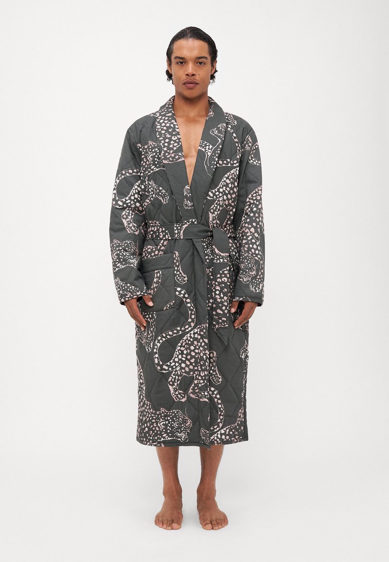 Quilted robe in dark gray with pink animal print. Features a belt, broad sleeves, and side pockets. Fabric appears textured and soft.