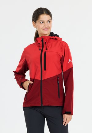 Red outerwear jacket with a contrasting dark red lower section. Features zippered pockets, a hood, and adjustable cuffs. Smooth texture.