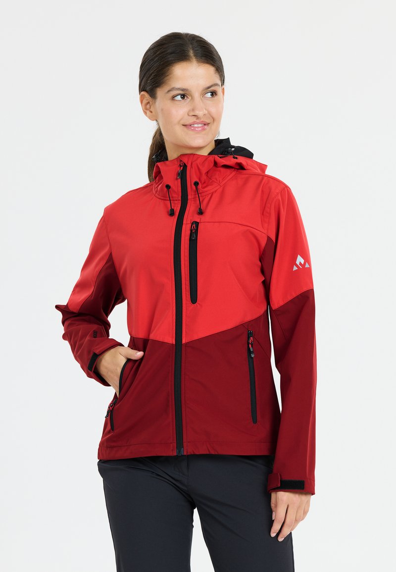 Red outerwear jacket with a contrasting dark red lower section. Features zippered pockets, a hood, and adjustable cuffs. Smooth texture.