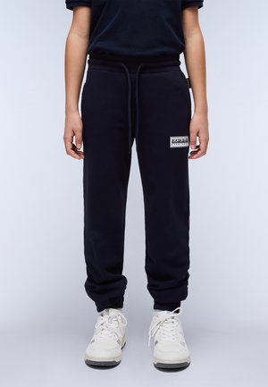 Navyblaue Sweatpants aus Baumwollmischung, mit elastischem Bund und Kordelzug, Bündchen an den Knöcheln und einem kleinen Logo-Patch an der Oberschenkelinnenseite.