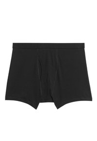 Zwarte katoenen boxershorts met een getailleerd ontwerp, voorzien van een opening met ritssluiting aan de voorkant en een zachte tailleband. Glad textuur met minimale stikseldetails.