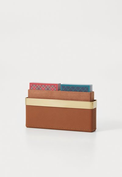 Brown leather cardholder with a gold metal accent, featuring two insert slots containing colorful cards with plaid patterns.
