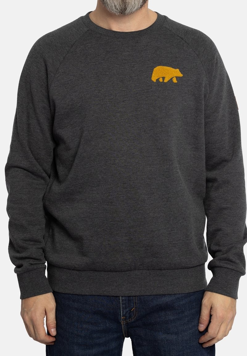 Sudadera gris oscura con mangas largas, puños acanalados y un diseño de oso amarillo en el pecho. Textura suave, ajuste casual y escote redondeado.
