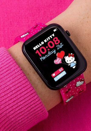Smartwatch zeigt Hello Kitty-Zifferblatt mit Uhrzeit, Datum, Herzfrequenz, Schrittanzahl und einem pinkfarbenen, Hello Kitty-themed Armband am Handgelenk.