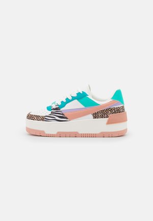 Multicolored sneaker featuring a mix of materials: white, turquoise, pink, and animal print accents. Thick white sole with pink trim.