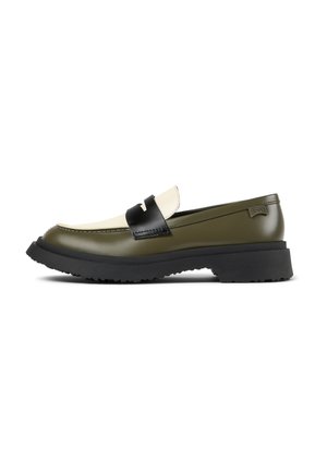 Olive green slip-on shoes with black and cream accents, featuring a chevron design on the strap and a textured rubber sole.