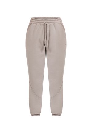 Pantalons de survêtement beiges avec taille élastique et cordon de serrage. Poignets côtelés aux chevilles et coutures latérales avec un détail de design courbé. Matériau doux.