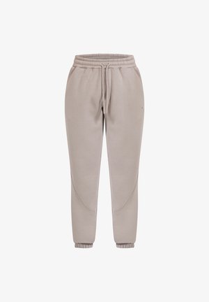 Beige sweatpants met een elastische tailleband en trekkoord. Ribgebreide manchetten bij de enkels en de zijnaad hebben een gebogen ontwerpdetail. Zacht materiaal.