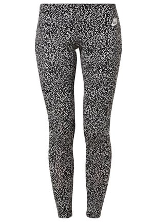Lange schwarz-weiß gesprenkelte Leggings mit hohem Bund und einem kleinen weißen Nike-Logo an der linken Hüfte.