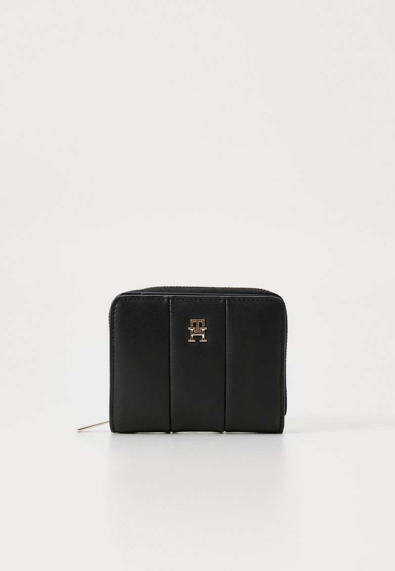 Black leather wallet with a zip closure, featuring quilted design and a gold logo on the front. Smooth texture and rectangular shape.
