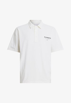 White polo shirt made of cotton with short sleeves, a buttoned collar, and a black logo on the left side. Smooth texture, classic fit.