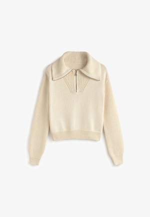 Pletena krema pulover s visokim ovratnikom, polu-rajserfrontom, rebrastim manžetama i teksturiranim panelima na prsima i rukavima.