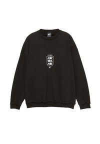 Fekete kereknyakú pulóver, három fehér oroszlánnal egy pajzson, „STWD” felirattal a mellrészen, bordázott mandzsettákkal és alsó résszel.