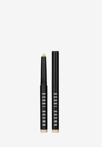 Bobbi Brown make-uppotlood in zwarte verpakking met gouden accenten. Beschikt over een draaisysteem en een romige, beige punt.
