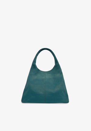 Sac à main en cuir bleu sarcelle avec une anse large et arrondie et un design minimaliste, présenté de face sur un fond blanc uni.