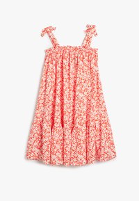 Rød og hvid blomsterkjole med en smocked bodice, bindesnore og lagdelt skørt. Lavet af letvægtsstof med en blød tekstur.