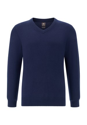 Tamsiai mėlynas V formos kaklo megztinis iš švelnios medžiagos, su ilgomis rankovėmis, riestais rankogaliais ir apačia, suteikiančia prigludusį rezultatą. Be matomų raštų ar akcentų.