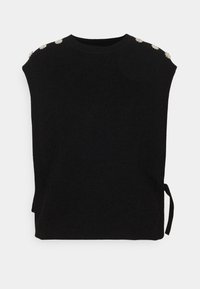 Top noir en tricot avec un col rond, détail de lien sur le côté et embellissements décoratifs sur l'épaule. Texture lisse, coupe décontractée.