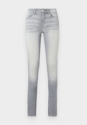 Jeans skinny bleu clair avec un dégradé, comportant cinq poches, une fermeture à bouton à l'avant et un léger délavage au niveau de la cuisse.