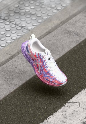 Lightweight running shoe with a white upper, purple and red graphic design, textured midsole, and a purple translucent outsole.
