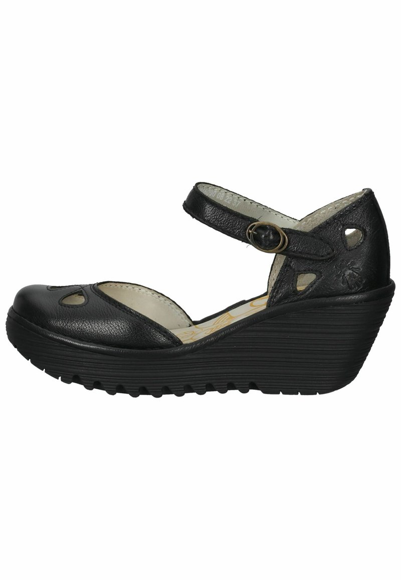 Black leather wedge sandal with cutout designs, an ankle strap featuring a buckle, and a textured rubber sole.