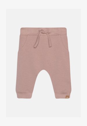 Helle rosa Jogginghose aus weichem Stoff, mit einem elastischen Bund und Kordelzug, seitlichen Taschen und einem kleinen Logo-Tag.