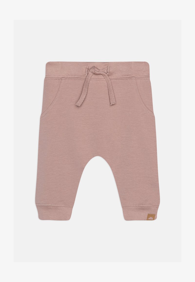 Helle rosa Jogginghose aus weichem Stoff, mit einem elastischen Bund und Kordelzug, seitlichen Taschen und einem kleinen Logo-Tag.