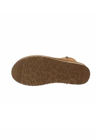 La suola marrone della scarpa presenta un design testurizzato con vari motivi; il materiale sembra gomma, offrendo aderenza e durata.