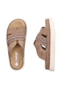 Brown suede slide sandals with cross straps, decorative stitching, and textured white rubber soles. Soft inner lining for comfort.