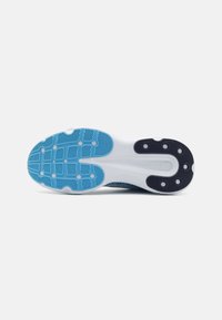 Athletic shoe outsole featuring a blue and white color scheme, textured rubber for grip, and black accents with circular traction points.