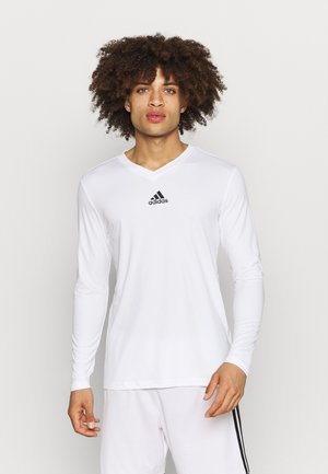 Weißes langärmliges Sporthemd mit V-Ausschnitt und schwarzem Adidas-Logo auf der Brust; glattes Material mit enger Passform.