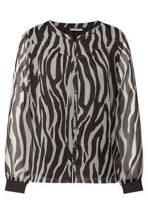 Blouse à motif zèbre noir et blanc avec des manches longues transparentes, un col rond et un devant à boutons avec des boutons colorés.
