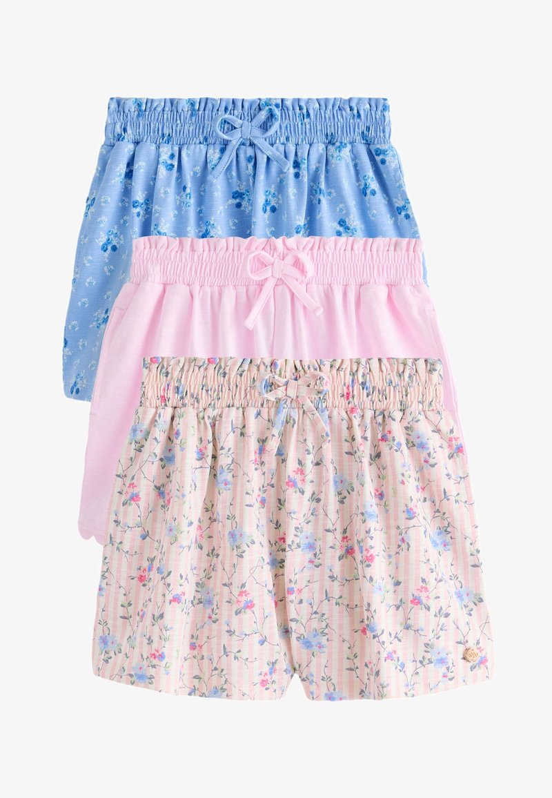 Tres pantalones cortos con cintura elástica y lazos: azul con flores, rosa liso y rosa a rayas con pequeñas flores.