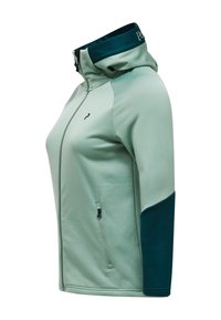 Lichtgroene gewatteerde jas met capuchon, donker groene elleboogstukken, ritssluiting aan de voorkant, zak aan de voorkant en logo op de borst, zijaanzicht.