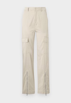 Beige cargo pants with a relaxed fit, featuring side pockets, zippered cuffs, and a smooth texture. Fabric is lightweight and durable.