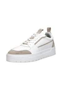 White leather sneaker with beige suede accents, perforated design, lace-up front, and a thick white rubber sole. Features a pull tab at the heel.