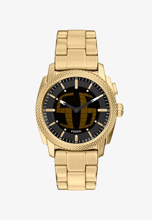 Montre-bracelet Fossil ton or avec cadran noir, index dorés et affichage analogique à trois aiguilles, dotée d'une lunette texturée et d'un bracelet à maillons.