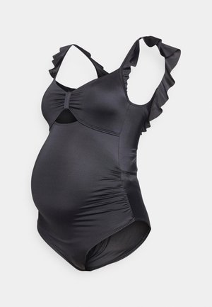 Maternity swimsuit in solid black. Features ruffled straps, a knot at the bust, and ruched sides for a fitted look. Smooth, stretch fabric.